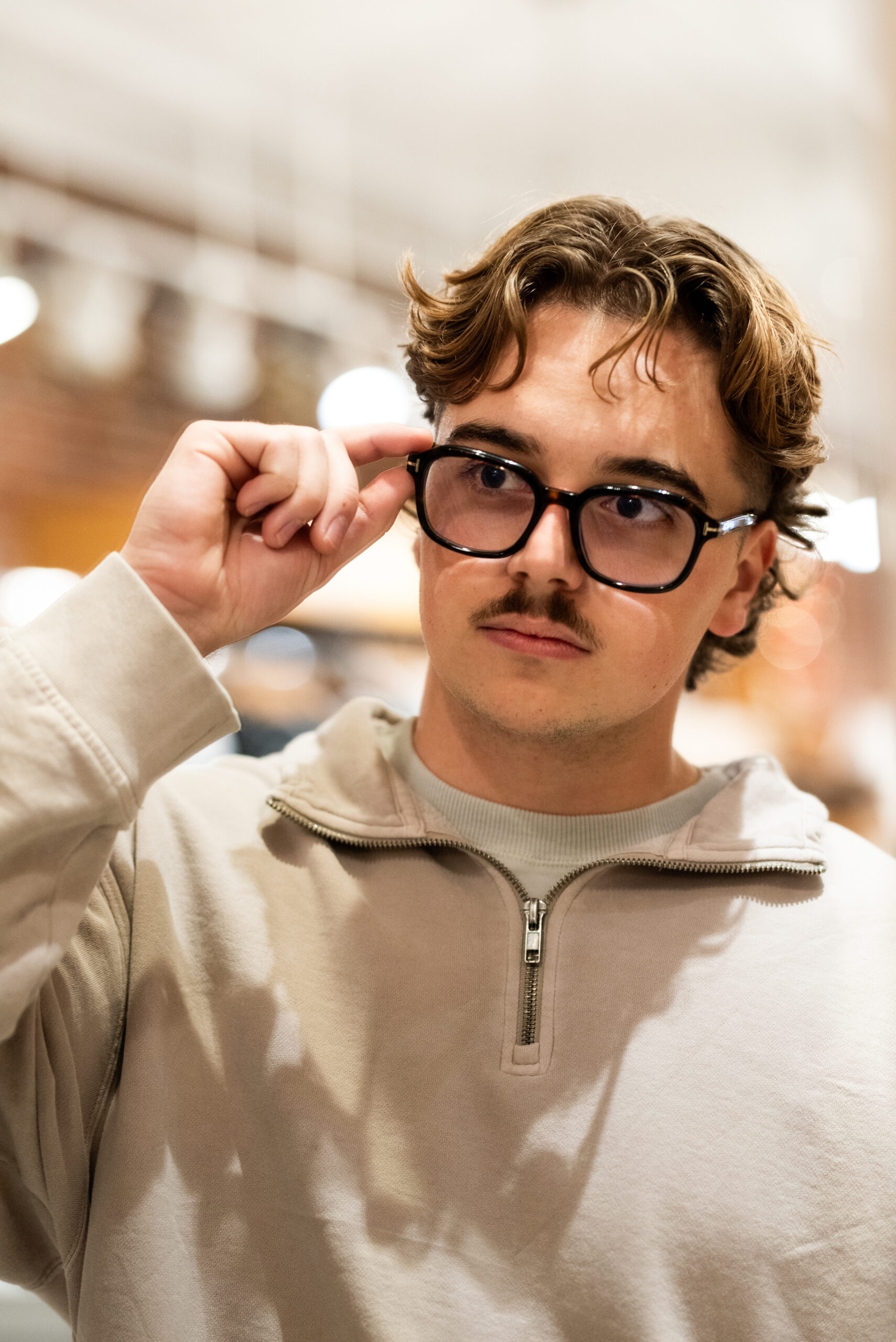 man trying on glasses nicola eye vare
