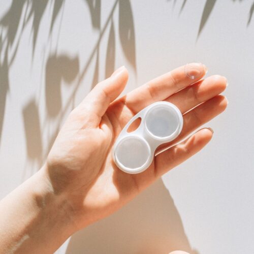 a professional has glasses and contact lenses ready to tackle their day in kamloops bc