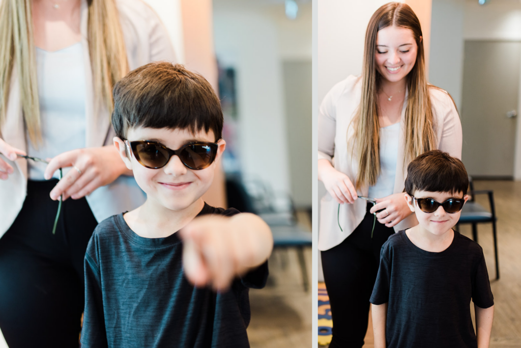 A child trying on glasses frames at Nicola Eye Care's optical boutique in Kamloops