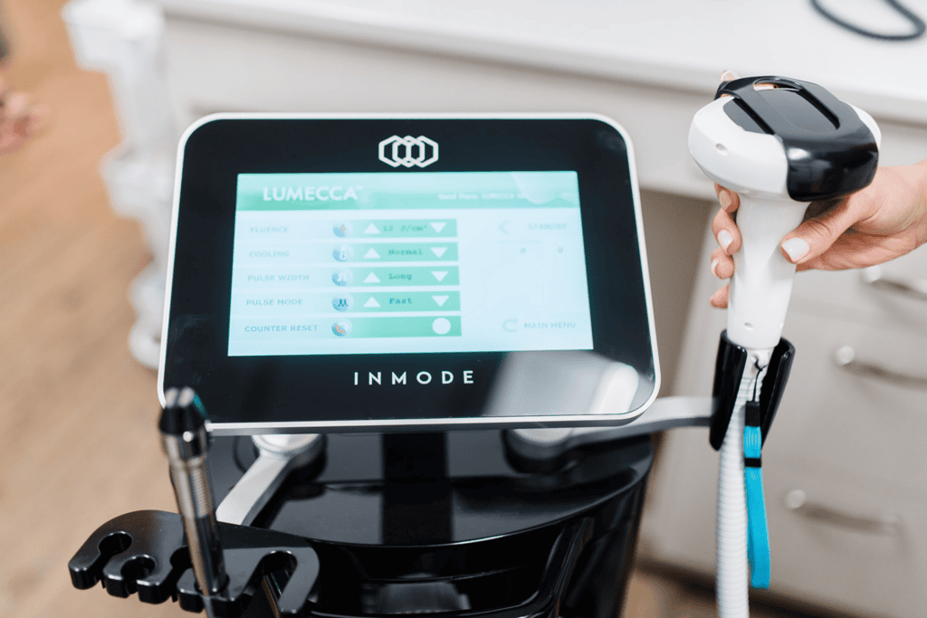 Close-up of the InMode Lumecca IPL handpiece and treatment settings used for dry eye treatment.