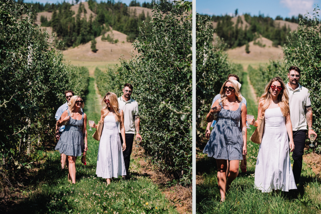 Group wearing sunglasses while walking through an orchard on a sunny day in British Columbia.